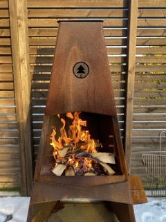 Photo of an outdoor fireplace burning