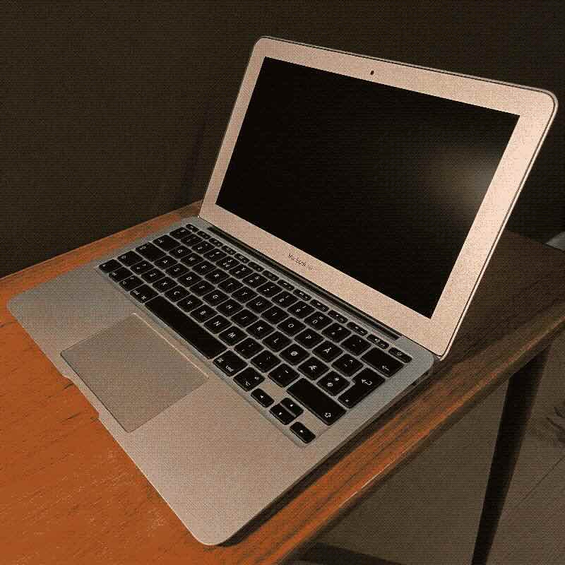 A dithered image of an 11" Macbook Air laptop from 2011 that I'm using as a digital typewriter