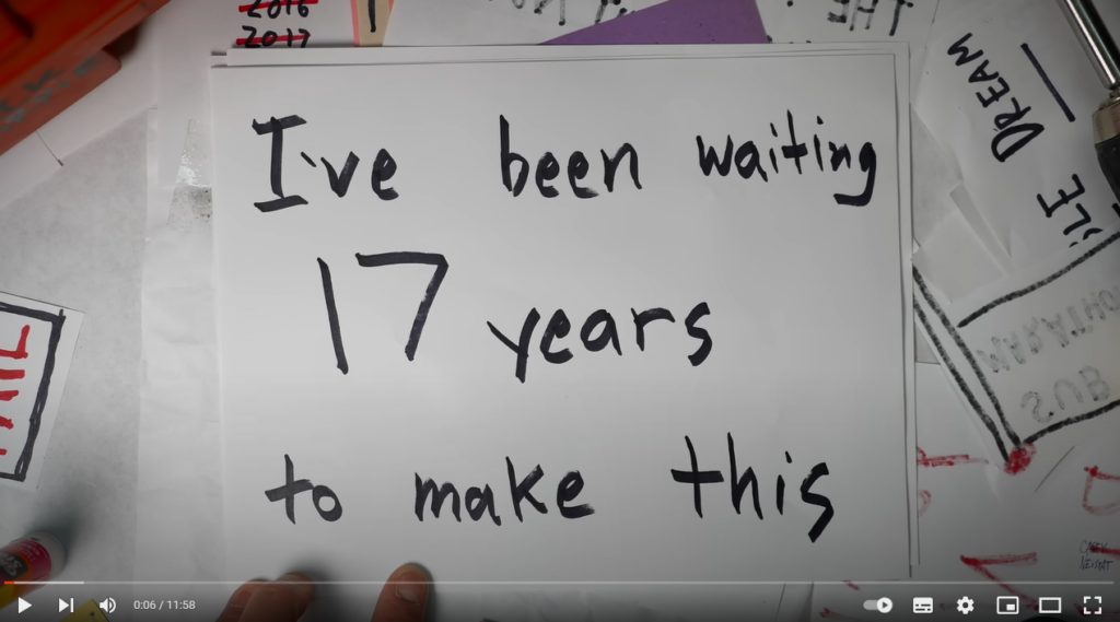 Screencap from the video "Sisyphus and the impossible dream" by Casey Niestat. It shows a white paper sheet with the writing "I've been waiting 17 years to make this"